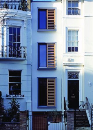 Exterior shot of narrow three-story house